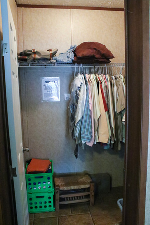 master closet with access to hot water heater
