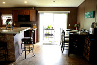 Open living/kitchen area - showing dining area and sliding glass door