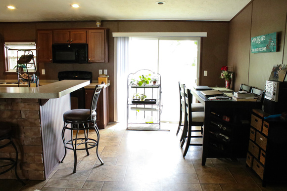 Open living/kitchen area - showing dining area and sliding glass door